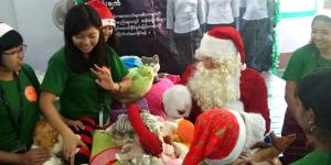 Compassionated volunteers with Santa Clause