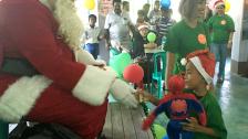 Santa gives a stuff for “one stuffed animal toy per orphaned child” program on Christmas
