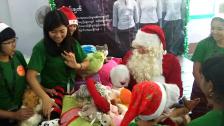 Compassionated volunteers with Santa Clause